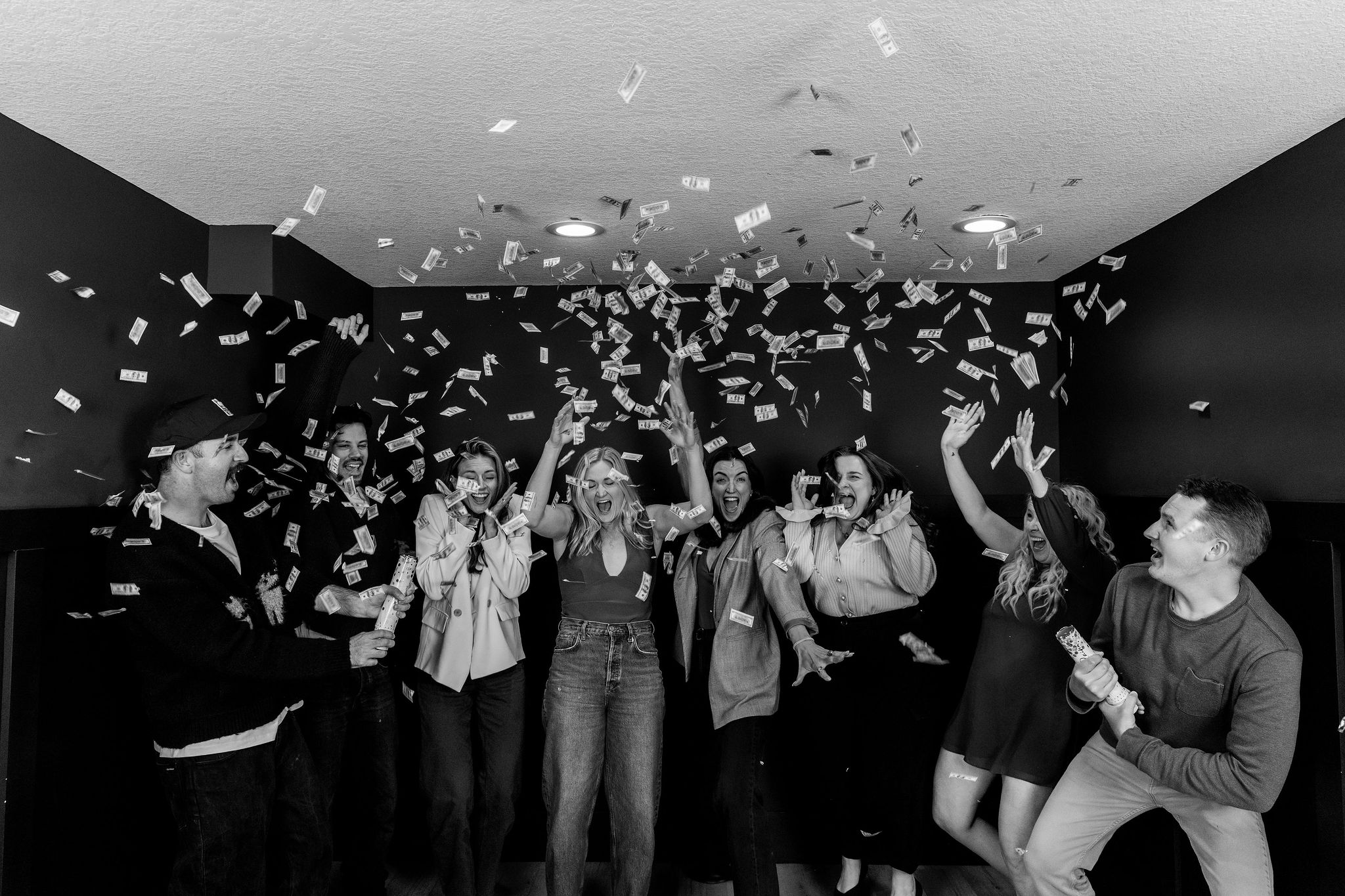 The team, mid-celebration, confetti in the air